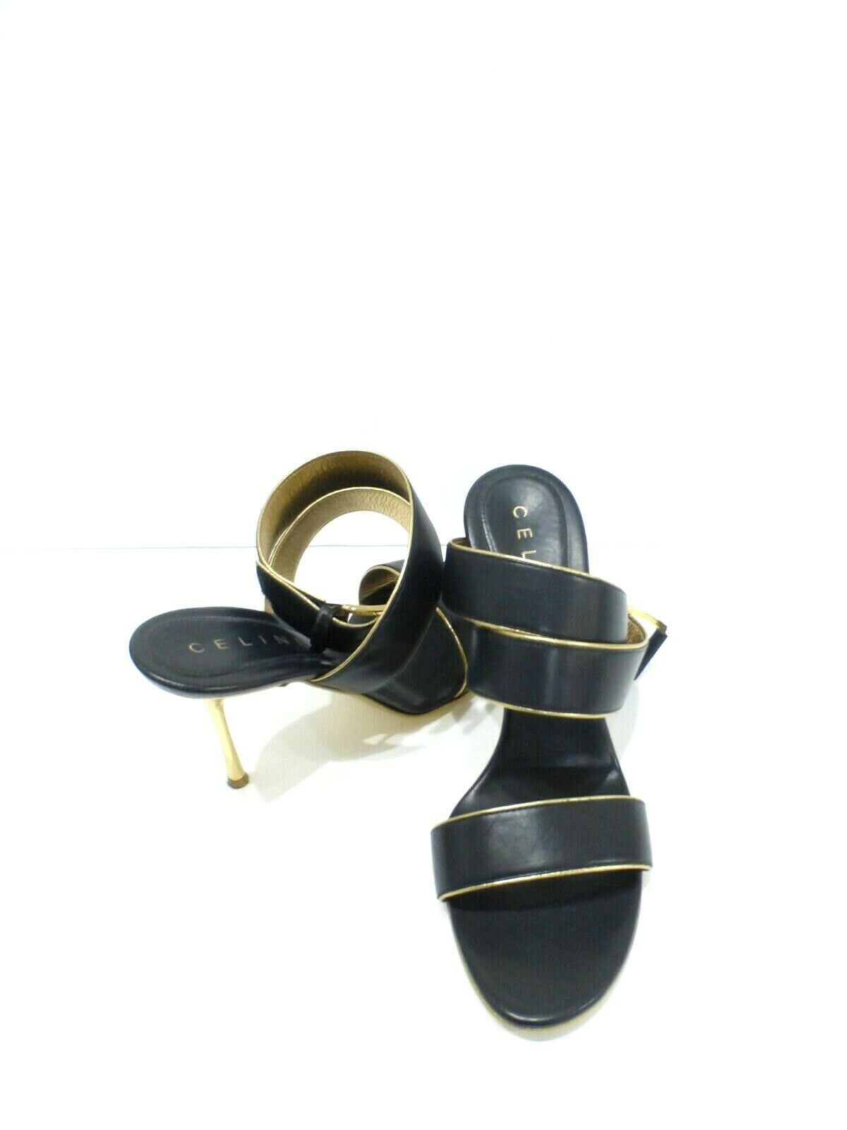 black sandals with gold trim
