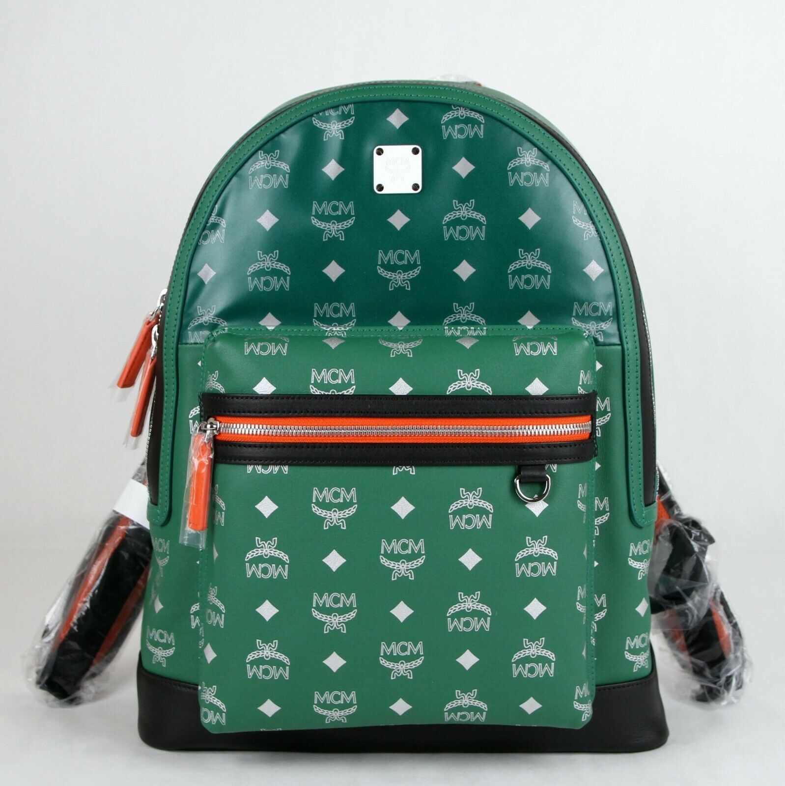 green mcm backpack