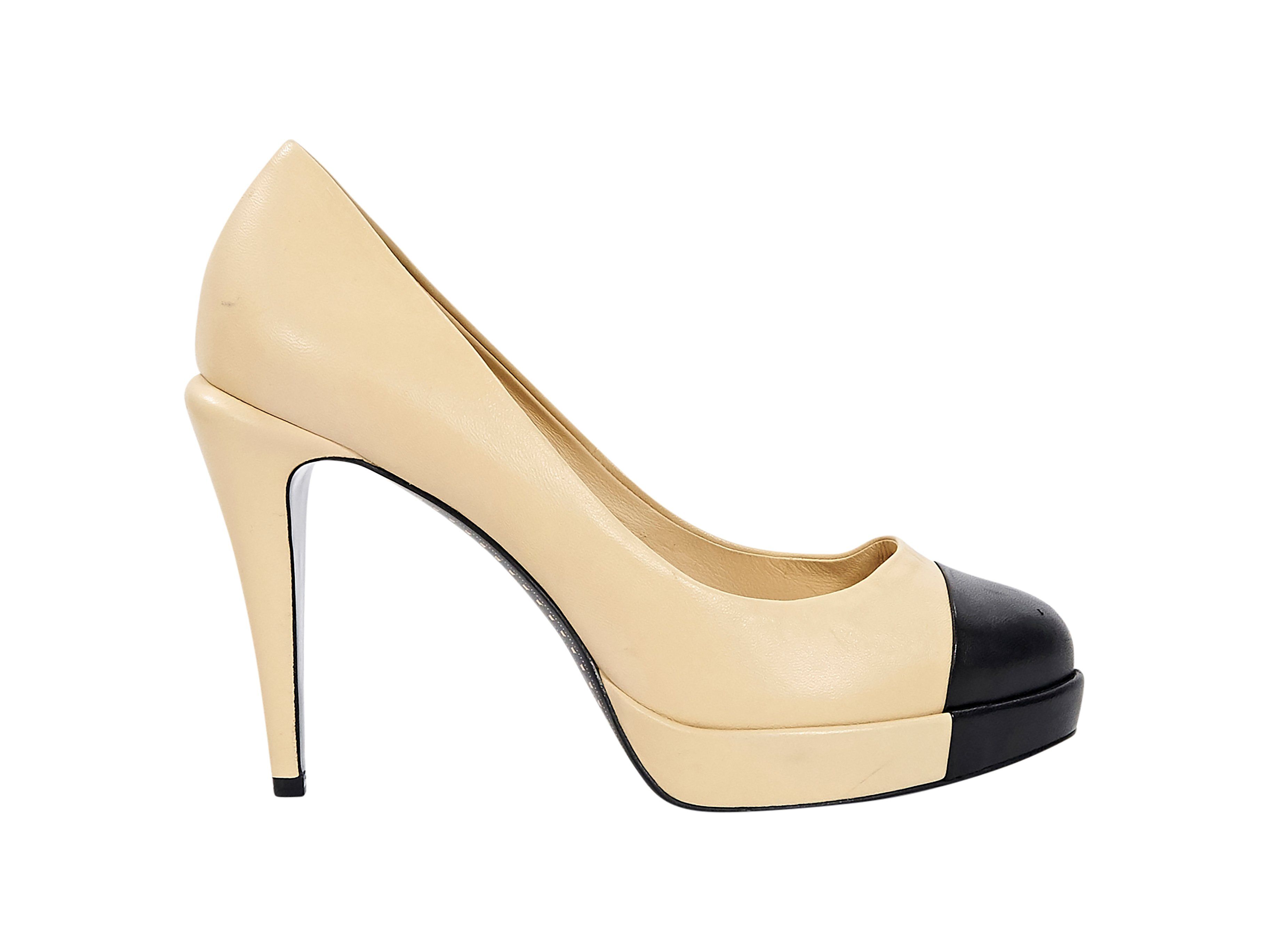 cream and black pumps