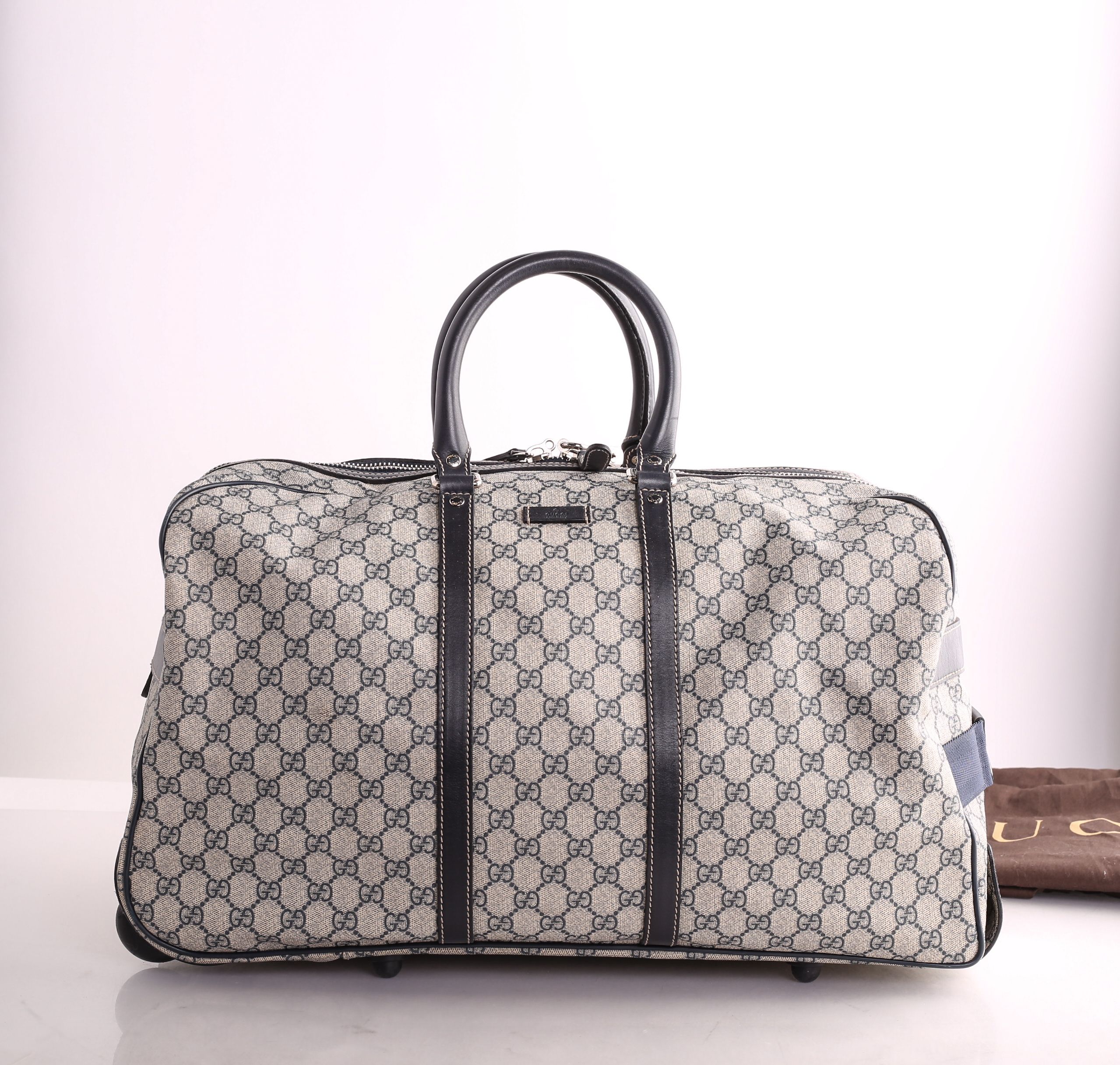 gucci rolling luggage